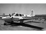 1965 : Beechcraft Travel Air twin engine (VH-CLX) on a one-day charter from Connellan Airways was used by Nat Map’s HA Johnson for an extremely low level traverse route reconnaissance flight in the northern Tanami Desert. The former VH-CLX is shown here after passing to the Royal Flying Doctor Service and re-registered as VH-FDX.