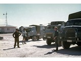 1969 : At Coober Pedy - (L-R) Milton Biddle, Andrew Turk, Eric Marques (in centre vehicle cab) & Oystein Berg.