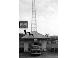 1962-64 : Aerial Survey Team (AST)-7, Net Communication Station (NCS) not far from Jackson Field Port Morseby, that was the radio hub for all ground stations. The sign over the door is enlarged as an insert and APCS stands for Air Photographic and Charting Service and MATS the Military Air Transport Service.
