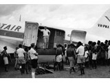 March 1964 : Loading the Papuan Air Transport (PATAIR) DC3 (VH-PNA) at Telefomin with equipment from Station 37.