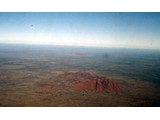 Northern Territory : Three rocks in a row - The Olgas, Ayers Rock (Uluru) and Mt Connor in the haze on the horizon.