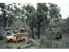 1969 TG038 Geodetic survey camp Warrambungle Ranges NSW, Bobroff in vehicle doorway and Mick Tonks and others in background.