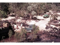 1969 TG046 Geodetic survey camp Cape York, Peter Langhorne standing blue shirt, David Yates foreground and others.