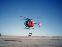 1970 : At Birdsville, Jayrow helicopter VH-BLO taking fuel into the Simpson for refuelling.
