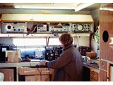 1972 : Mick Skinner undertaking field repairs to Aerodist master unit in workshop caravan.