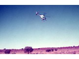 1969 : Hughes 500 369HS helicopter (VH-SFS) on charter from Jayrow Helicopters Pty Ltd was used to support Aerodist groundmarking operations. VH-SFS is shown here in the Simpson Desert.