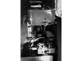 Circa early 1960s : Aerodist trilateration photographic system as seen by the operator. The vertically mounted Vinten 70mm camera is nearest the operator's seat and the Wild HC-1 35mm horizon camera near the door. At the instant of exposure by the Vinten the HC-1 captured the horizon as seen fore, aft, port and starboard of the aircraft. These four images allowed the tip and tilt of the Vinten image to be calculated for the instant of exposure.