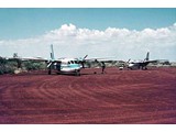 1974 : Right is VH-EXZ in front of VH-EXP at Balgo Mission, Western Australia.
