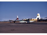 1977 : Alice Springs  - Nomad N22B-25 VH-DNM (front) and Flying Doctor Nomad N24A-38 (rear) VH-DHR. The N24A was a 'stretched' Nomad version.